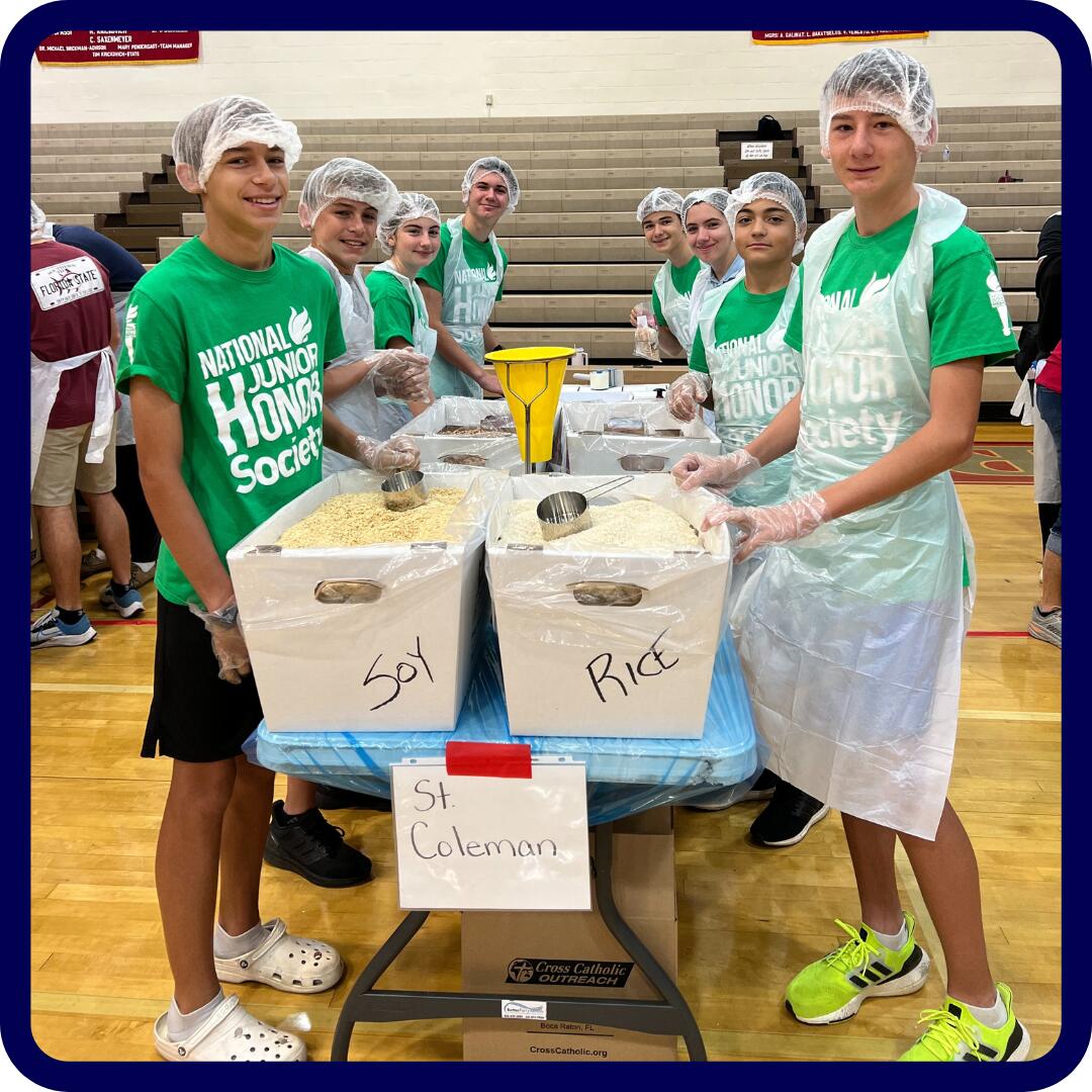 NJHS students preparing food donations.