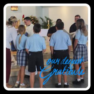Students presenting appreciation gifts  to our priests.